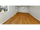 Spacious living room features modern windows and stunning wood-look flooring at 3187 Clifton Church Rd, Atlanta, GA 30316
