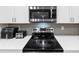 Modern kitchen featuring stainless appliances, quartz countertops and white cabinets at 557 Clinton Dr, Temple, GA 30179