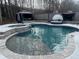 Beautiful in-ground swimming pool and jacuzzi with an outdoor lounge area at 557 Clinton Dr, Temple, GA 30179