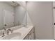 Modern bathroom with a double sink vanity, large mirror and stylish fixtures at 2212 Whistler Ne Way, Lawrenceville, GA 30043