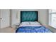 Neutral bedroom features a large window, carpet, and a tufted headboard at 2212 Whistler Ne Way, Lawrenceville, GA 30043