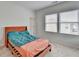 Cozy bedroom bathed in light from two windows, showcasing a comfortable bed and neutral decor at 2212 Whistler Ne Way, Lawrenceville, GA 30043