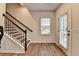 Entryway with staircase, wooden floors, and natural light from the front door at 2212 Whistler Ne Way, Lawrenceville, GA 30043