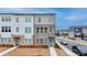 Beautiful new townhome with a manicured lawn and two-tone neutral exterior at 2212 Whistler Ne Way, Lawrenceville, GA 30043