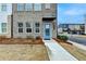 Close-up view of townhome's entrance, highlighting the bright blue door and modern design at 2212 Whistler Ne Way, Lawrenceville, GA 30043