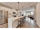 Modern eat-in kitchen open to the living room with stainless steel appliances and a large island at 2212 Whistler Ne Way, Lawrenceville, GA 30043
