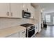 Modern kitchen with stainless steel appliances and white subway tile backsplash at 2212 Whistler Ne Way, Lawrenceville, GA 30043