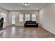 Bright living space features wood floors, three windows, natural light and recessed lighting at 2212 Whistler Ne Way, Lawrenceville, GA 30043