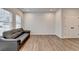 Bright living room with modern vinyl floors, couch, and a door with double doors at 2212 Whistler Ne Way, Lawrenceville, GA 30043