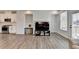 Open living room with wood floors and access to the kitchen at 2212 Whistler Ne Way, Lawrenceville, GA 30043