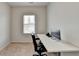 Carpeted office with a large desk and a window at 2212 Whistler Ne Way, Lawrenceville, GA 30043