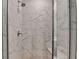Modern bathroom featuring a shower, marble-style tile and glass door at 2212 Whistler Ne Way, Lawrenceville, GA 30043