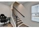 Staircase with wood stairs and railings, with white risers at 2212 Whistler Ne Way, Lawrenceville, GA 30043
