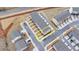 Aerial view of a modern gray townhouse with well-maintained landscaping in a friendly neighborhood at 2212 Whistler Ne Way, Lawrenceville, GA 30043