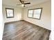 Bedroom features modern ceiling fan, two windows and wood look flooring at 2495 Se Glendale Se Cir, Smyrna, GA 30080