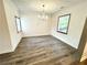 Bright dining room with wood floors and a decorative chandelier at 2495 Se Glendale Se Cir, Smyrna, GA 30080