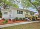 Charming single-story home featuring a landscaped front yard and welcoming entryway at 2495 Se Glendale Se Cir, Smyrna, GA 30080
