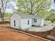 Exterior view of home with white siding and landscaping at 2495 Se Glendale Se Cir, Smyrna, GA 30080