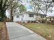 Charming single-story home featuring a concrete driveway and a well-maintained, landscaped front yard at 2495 Se Glendale Se Cir, Smyrna, GA 30080