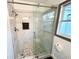 Bathroom featuring a tiled shower and a glass shower door at 2495 Se Glendale Se Cir, Smyrna, GA 30080