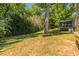 Beautiful backyard with mature trees, screened porch, and plenty of green space at 4230 Deerwood Se Pkwy, Smyrna, GA 30082
