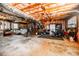 Spacious unfinished basement with laundry, utilities, and golf club storage at 4230 Deerwood Se Pkwy, Smyrna, GA 30082