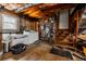 Exposed basement with washer, dryer, utility sink, and stairs leading to backyard at 4230 Deerwood Se Pkwy, Smyrna, GA 30082
