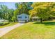 Charming two-story home with a well-maintained lawn and long driveway at 4230 Deerwood Se Pkwy, Smyrna, GA 30082