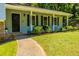 Charming single-story home with a welcoming front porch, well-manicured lawn, and inviting curb appeal at 4230 Deerwood Se Pkwy, Smyrna, GA 30082