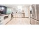 Modern kitchen with stainless steel appliances and white cabinets at 4230 Deerwood Se Pkwy, Smyrna, GA 30082
