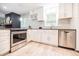 Updated kitchen with stainless appliances and white cabinetry at 4230 Deerwood Se Pkwy, Smyrna, GA 30082