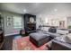 Open living room boasts a fireplace, large sectional couch, and seamless access to kitchen at 4230 Deerwood Se Pkwy, Smyrna, GA 30082