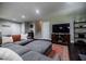 Comfortable basement living room with a large sectional couch and entertainment center at 4230 Deerwood Se Pkwy, Smyrna, GA 30082