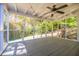 Inviting screened-in porch offering views of the lush, landscaped backyard at 4230 Deerwood Se Pkwy, Smyrna, GA 30082