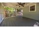 Cozy screened porch with a ceiling fan, offering a serene outdoor retreat at 4230 Deerwood Se Pkwy, Smyrna, GA 30082