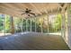 Large screened porch with overhead fan, perfect for outdoor relaxation at 4230 Deerwood Se Pkwy, Smyrna, GA 30082