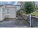 Home's backyard with concrete pavers, retaining wall, and grass at 1340 Bernard Nw St, Atlanta, GA 30314