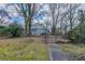 Backyard view of the house behind a chain link fence with a sidewalk to the house at 1340 Bernard Nw St, Atlanta, GA 30314