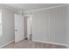 Bedroom with gray walls, beige carpeting and a door to the connecting hallway in the home at 1340 Bernard Nw St, Atlanta, GA 30314