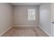Cozy bedroom with neutral paint, plush carpeting, and a bright window at 1340 Bernard Nw St, Atlanta, GA 30314