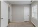 Bedroom with carpet, natural light from window, and two large closets at 1340 Bernard Nw St, Atlanta, GA 30314