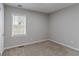 A simple carpeted bedroom painted with neutral colors featuring a window at 1340 Bernard Nw St, Atlanta, GA 30314