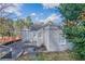 Backyard exterior of the home with natural landscaping, driveway, and a fenced lawn at 1340 Bernard Nw St, Atlanta, GA 30314