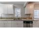 Close up shot of a kitchen showcasing granite countertops, stainless steel appliances, and cabinets at 1340 Bernard Nw St, Atlanta, GA 30314