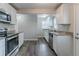Modern kitchen featuring stainless steel appliances, granite countertops, and wood flooring at 1340 Bernard Nw St, Atlanta, GA 30314