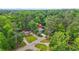Aerial image displaying a home situated in a lush, green neighborhood with mature trees and landscaping at 921 Cone Rd, Forest Park, GA 30297