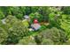 Bird's-eye view of a lovely home nestled among mature trees, highlighting the property's privacy at 921 Cone Rd, Forest Park, GA 30297
