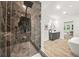 The bathroom features a glass shower with black hardware, marble-look tile, and double vanity at 921 Cone Rd, Forest Park, GA 30297