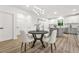 Bright dining area with a modern light fixture, table, and easy kitchen access at 921 Cone Rd, Forest Park, GA 30297