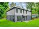 Charming two-story home with a well-maintained lawn and mature trees around property at 921 Cone Rd, Forest Park, GA 30297